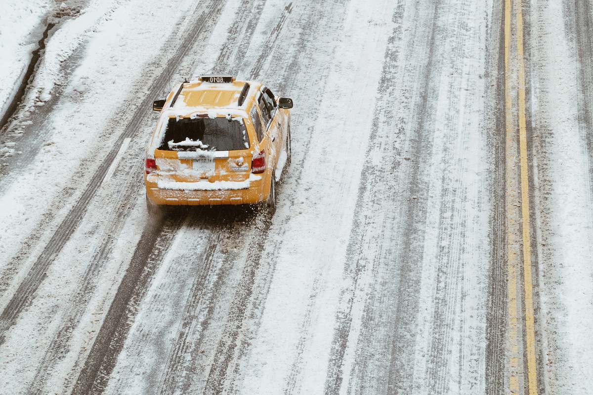 vehicle aerial shot of yellow car on the road united states